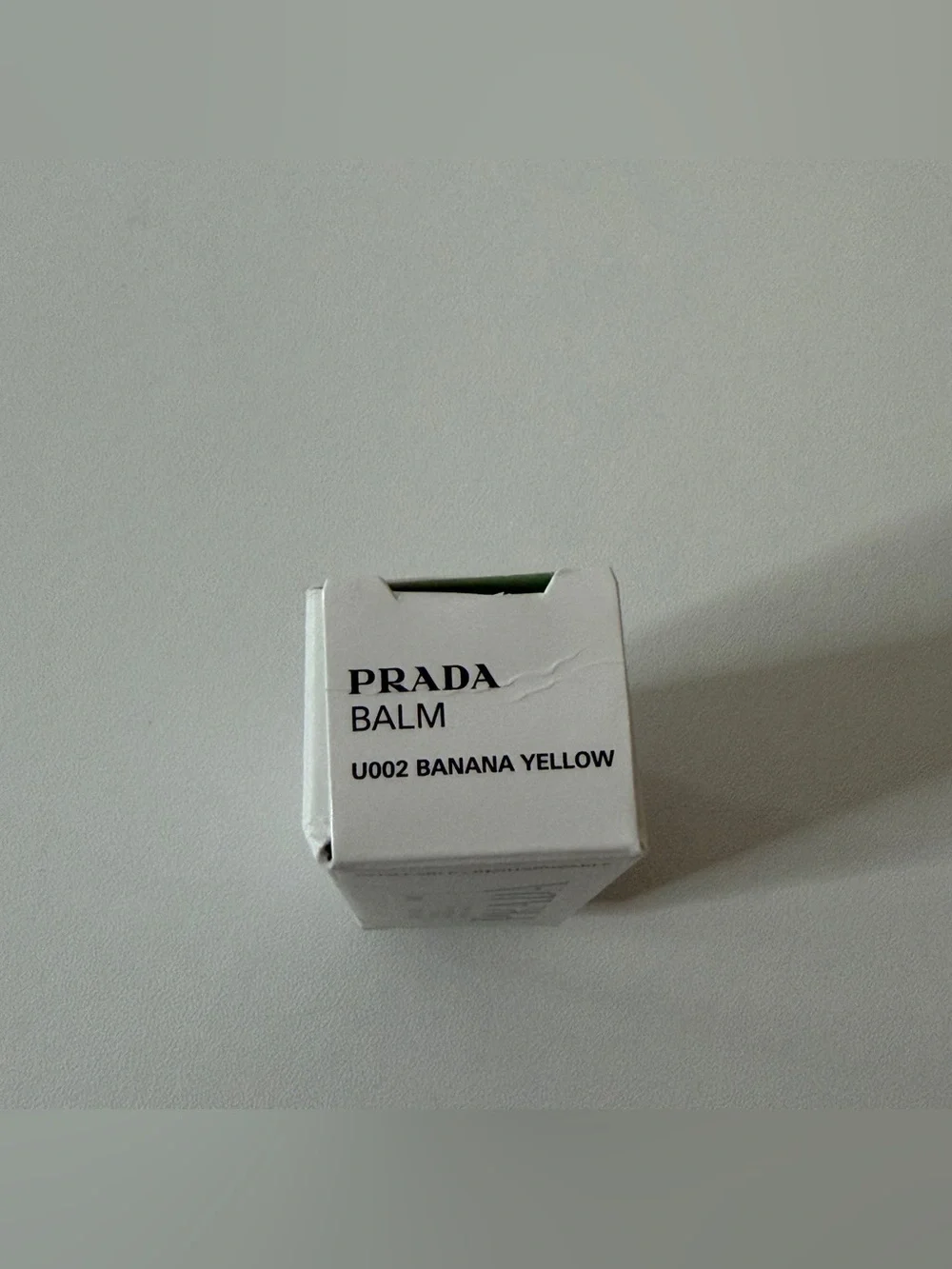 Prada Hydrating Lip Balm with Jojoba Oil (shade U002 banana yellow)